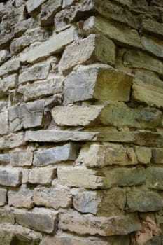 Stone masonry corner with rich and various texture.