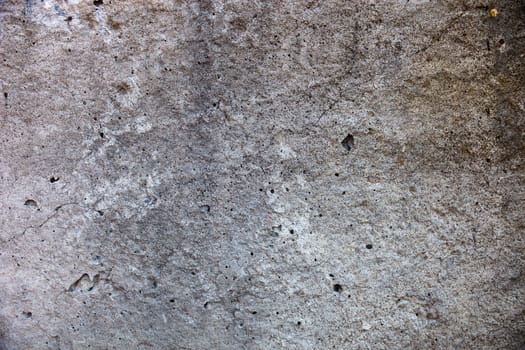 Grey concrete surface with rich and various texture. 