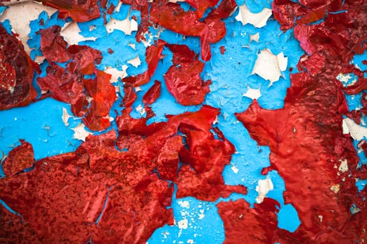 Blue-red-white cracked oil-painted surface with rich texture