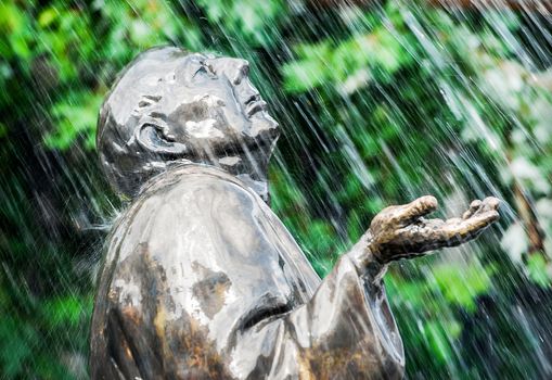 Statue of man in the rain