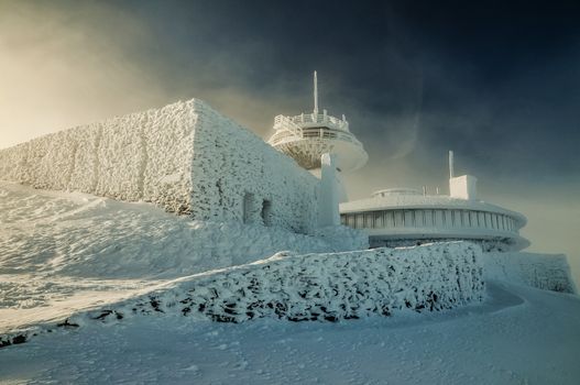 Buildings covered with snow and ice