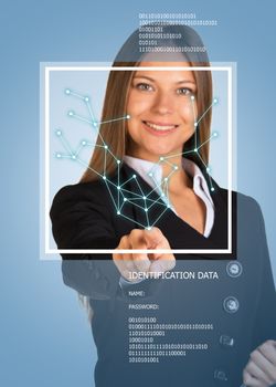 Beautiful blonde in suit pointing finger on virtual grid. Frame and text. Blue background
