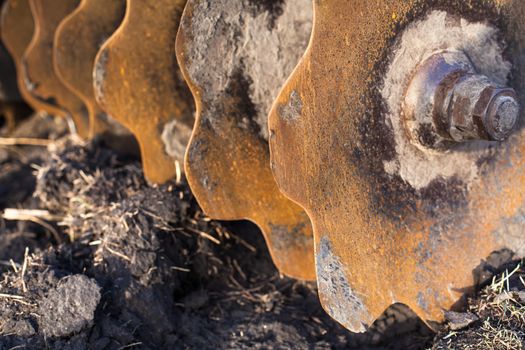 Disc harrow used to cultivate the soil. Close up.