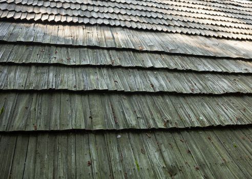 Old wooden shingle roof. Wooden surface texture.