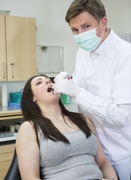 Male Dentist and female patient situation