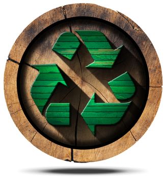 Green wooden recycling symbol on a section of tree trunk isolated on white background.