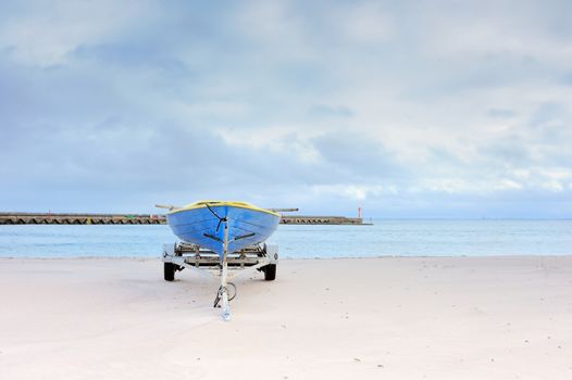 Old boat on the sandy beach