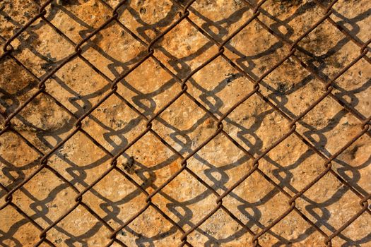 Metal rusty wire and old wall with mold