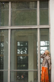 fashion portrait of a beautiful young woman on city background