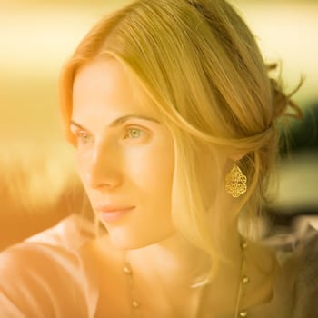 portrait of a beautiful young woman in a spring park. pictures in warm colors