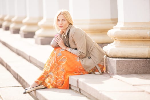 fashion portrait of a beautiful young woman on city background