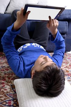 Child uses an iPad to communicate and play.