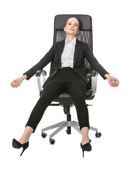 blonde businesswoman exhausted relaxing on a chair with stretched out arms