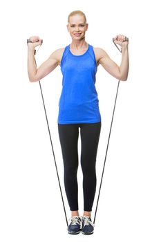 blonde woman wearing fitness clothing exercising with rubber band