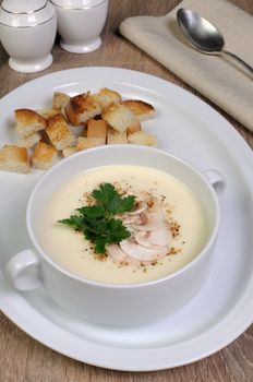 Plate of mushroom soup mashed spiced crispy bread croutons