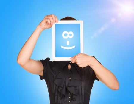 Girl in dress covered her face with tablet. On screen code smiley. Blue sky with sun light as backdrop