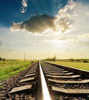 railroad closeup with reflections under sunset