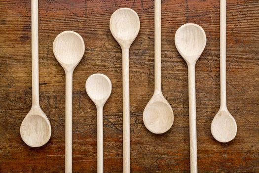 set of wooden spoons against grunge rustic wood