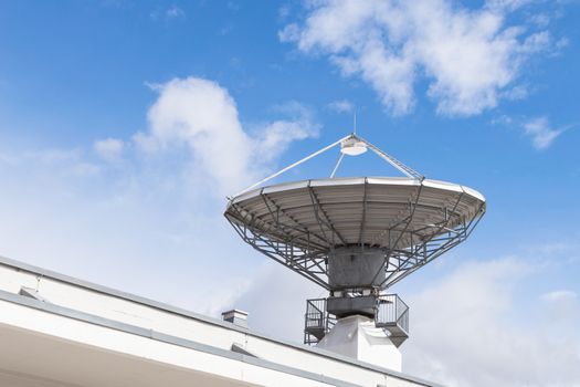 Military radiolocator station with parabolic radar antenna dish is part of missile defense antimissile system