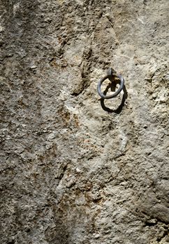 background or texture iron ring on a rock wall