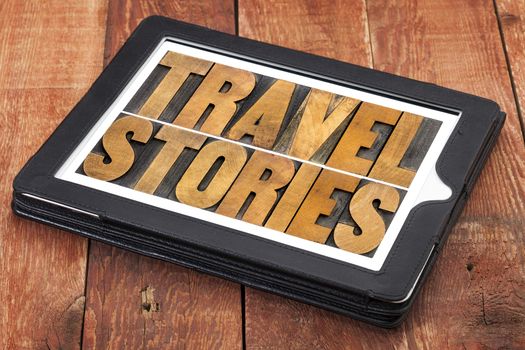 travel stories - word abstract in letterpress wood type on a digital tablet