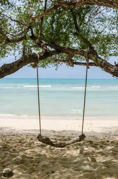 swing on beach sand and sea in Koh Samet Thailand