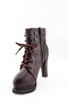 lady leather boot bown with shoelace on white background.