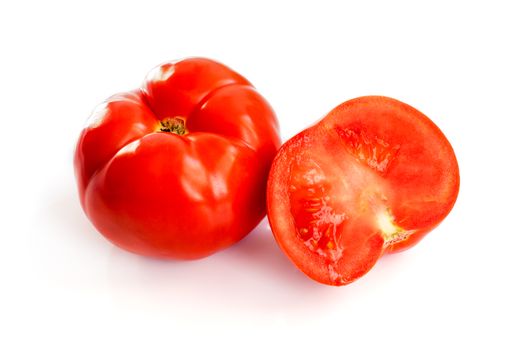 unadulterated and half of the tomato to rest upon white background