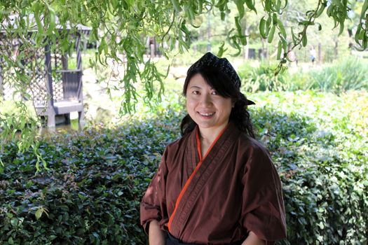 Portrait of a Japanese woman with traditional clothing.