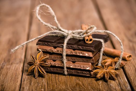 chocolate set, star anise and cinnamon sticks close up