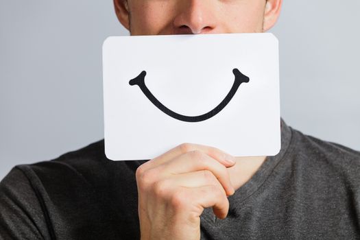 Happy Portrait of a Man Holding a Smiling Mood Board