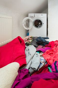 pile of dirty clothes ready for the wash in home bathroom