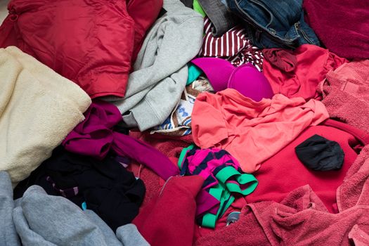 pile of dirty clothes ready for the wash in home bathroom