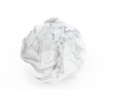 close-up of crumpled paper ball on white background