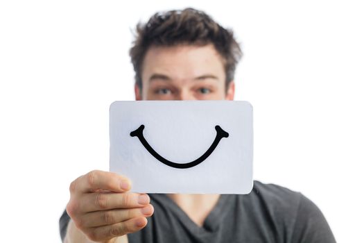 Happy Portrait of a Man Holding a Smiling Mood Board Isolated on White Background