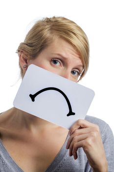 Unhappy Portrait of a Woman Holding a Sad Mood Board Isolated on white Background