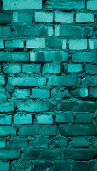 Background of Old Damaged Variegated Brick with Concrete Smoothing. Turquoise Toned