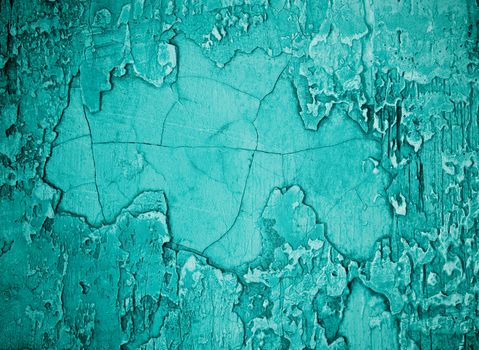 Turquoise Damaged Obsolete Cement Wall Background closeup 