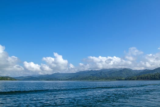 Lake mountain with clouds and blue sky