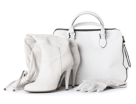 Ladies white leather gloves, bag and shoes, isolated