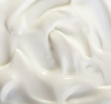 Close up view of cream on white background