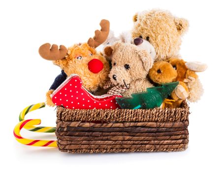 Stuffed animal toys in a christmas sledge isolated on a white background 