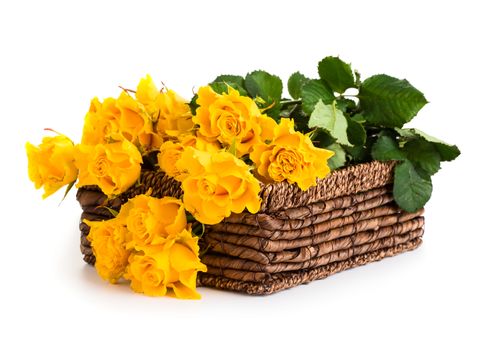 Beautiful bouquet of roses in basket isolated on white background