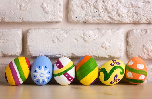 Easter eggs on brick wall background