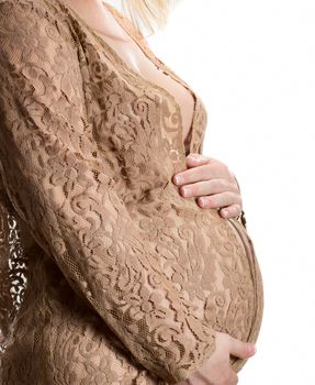 Close up view of pregnant belly isolated on white background