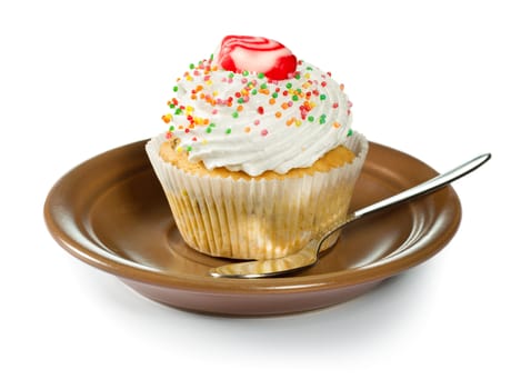Cupcake on brown plate isolated on white