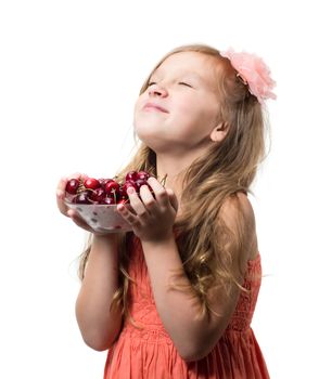 Little girl with cherries isolated over white background