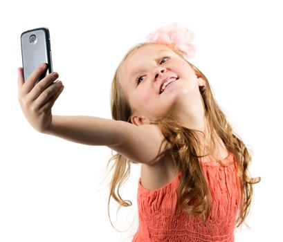 Little girl doing selfie over white background