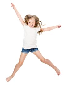Little girl jumping over a white background 