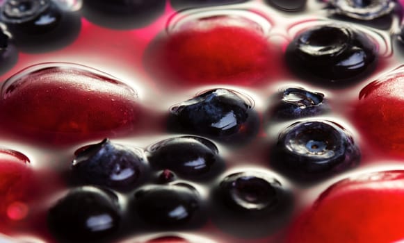 Close up view of cherries and blueberries in jelly